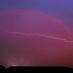 Lightning trough rainbow above Voorthuizen Holland